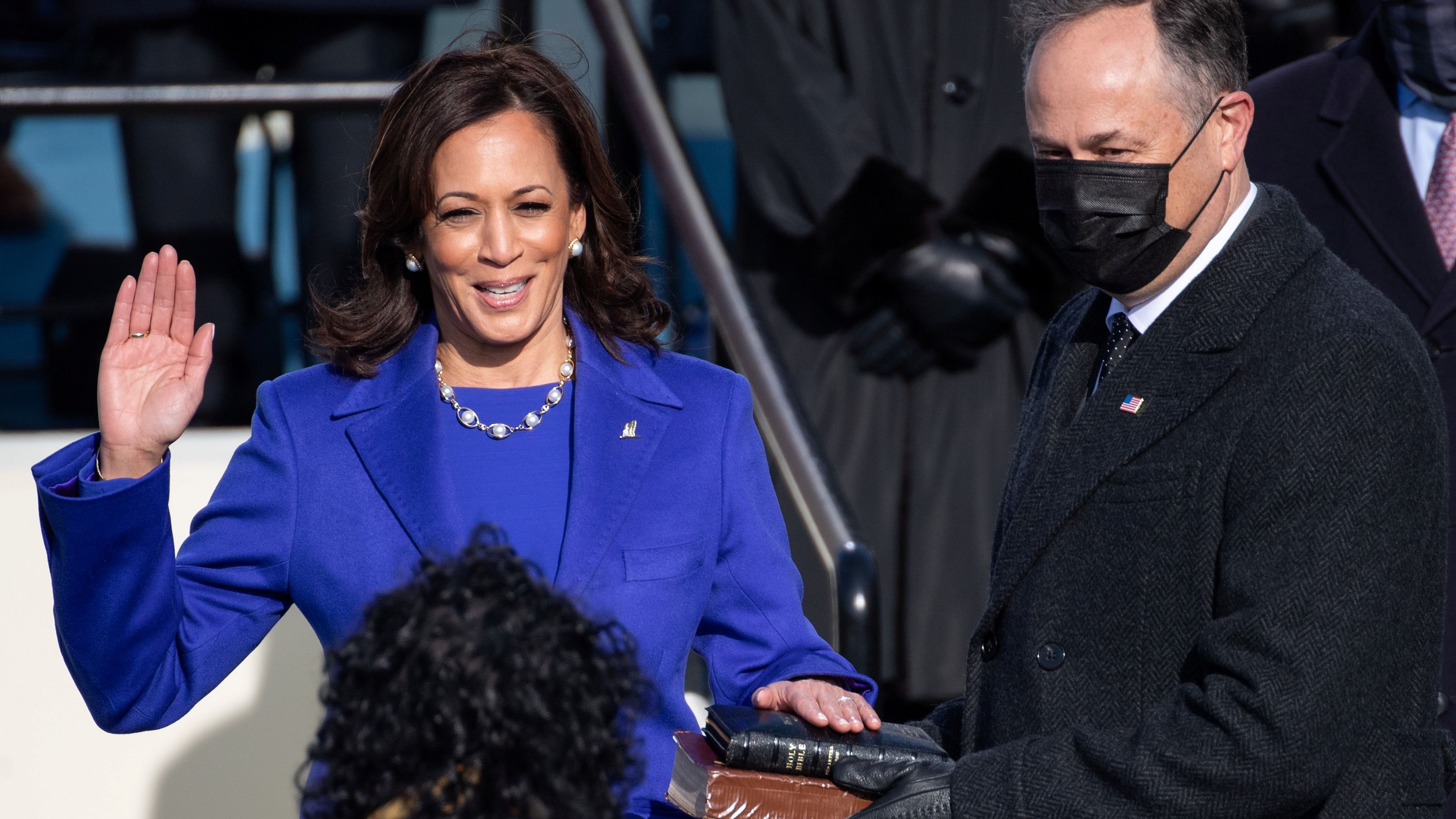 Kamala Harris is sworn in as Vice President as her spouse Doug Emhoff holds a bible during the 59th Presidential Inauguration at in Washington. Credit: Reuters