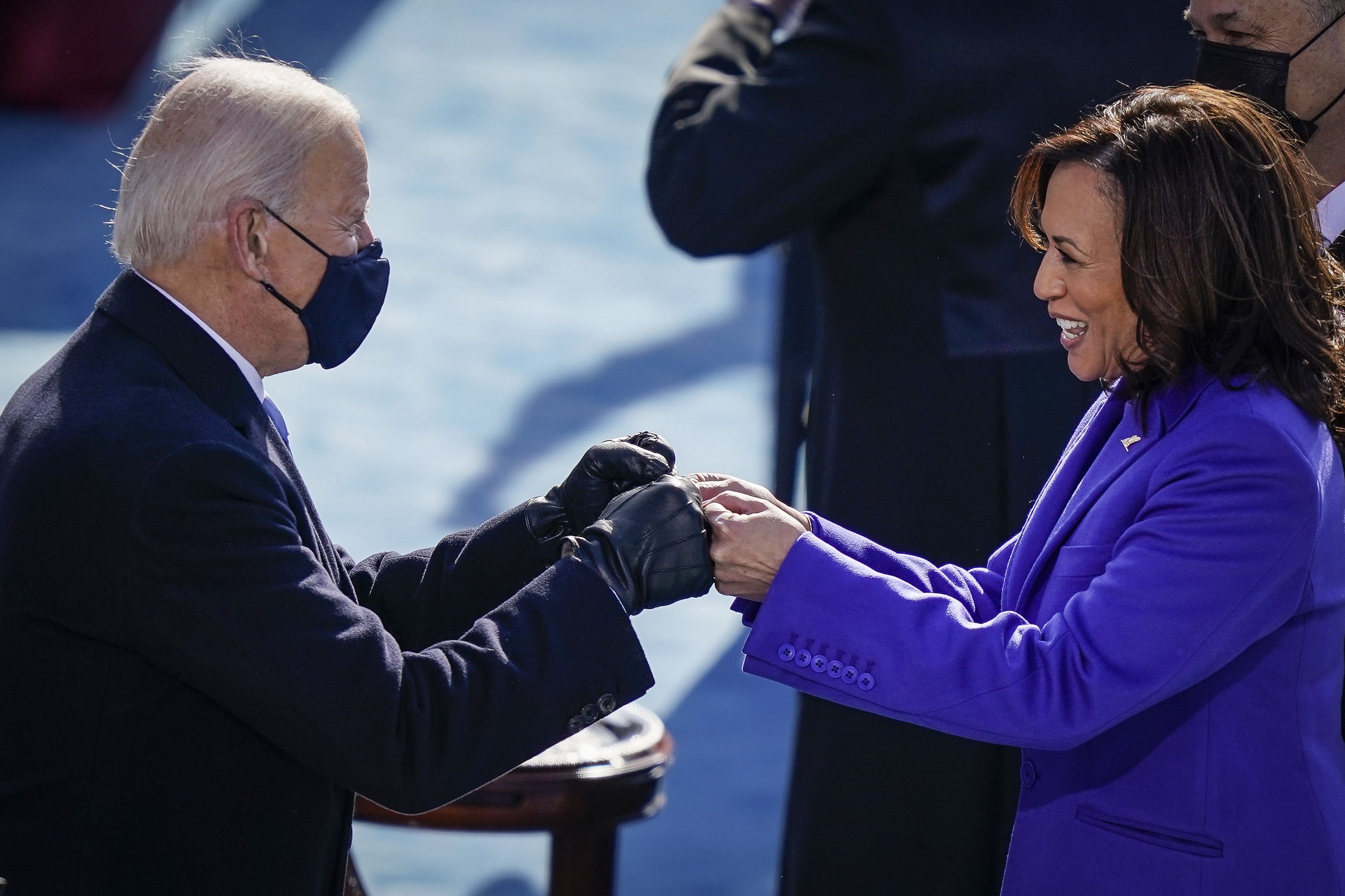 President-elect Joe Biden fist bumps newly sworn-in Vice President Kamala Harris after she took the oath of office on the West Front of the U.S. Capitol on January 20, 2021 in Washington, DC. Biden was sworn in today as the 46th president of the United States. Credit: Getty Images/AFP