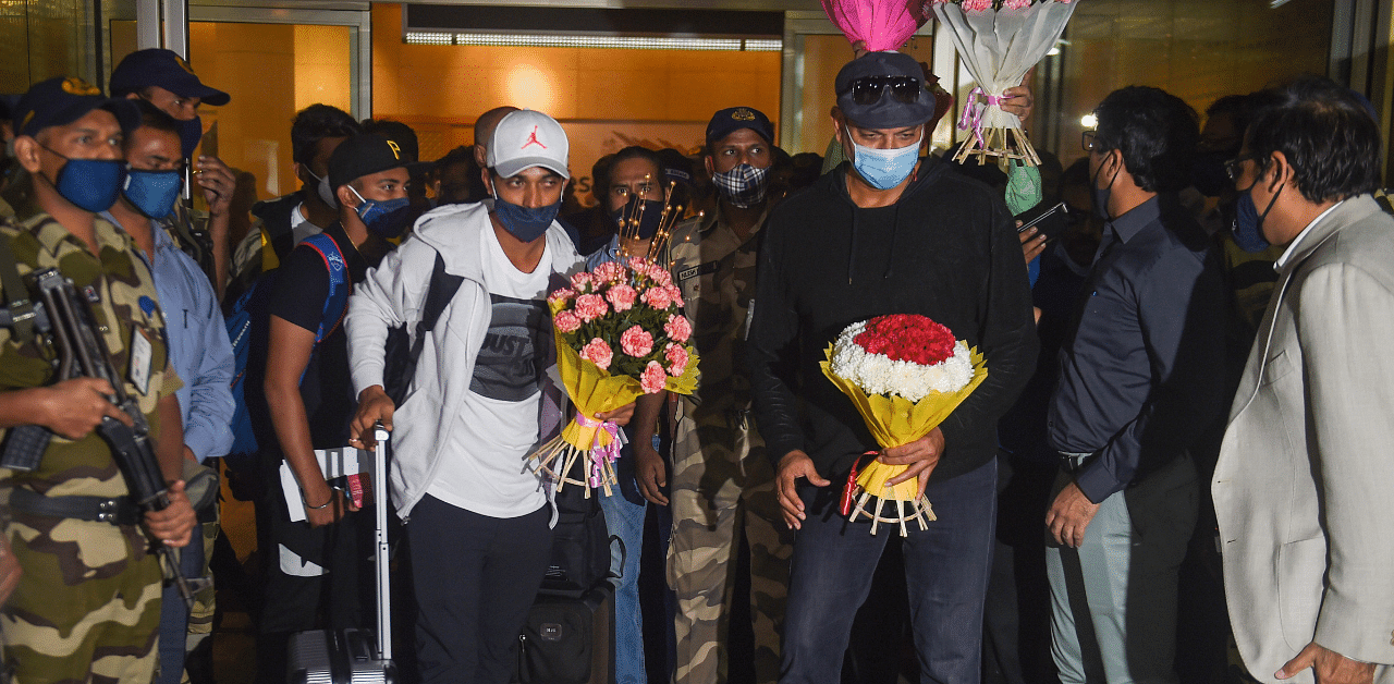 Indian cricket team stand-in captain Ajinkya Rahane and head coach Ravi Shastri arrive at Mumbai. Credit: PTI Photo