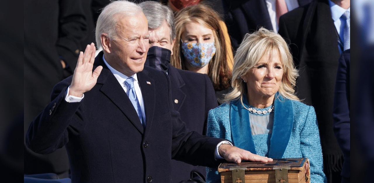 Joe Biden is sworn in as the 46th President of the United States as his wife Jill Biden holds a bible on the West Front of the U.S. Capitol in Washington. Credit: Reuters Photo