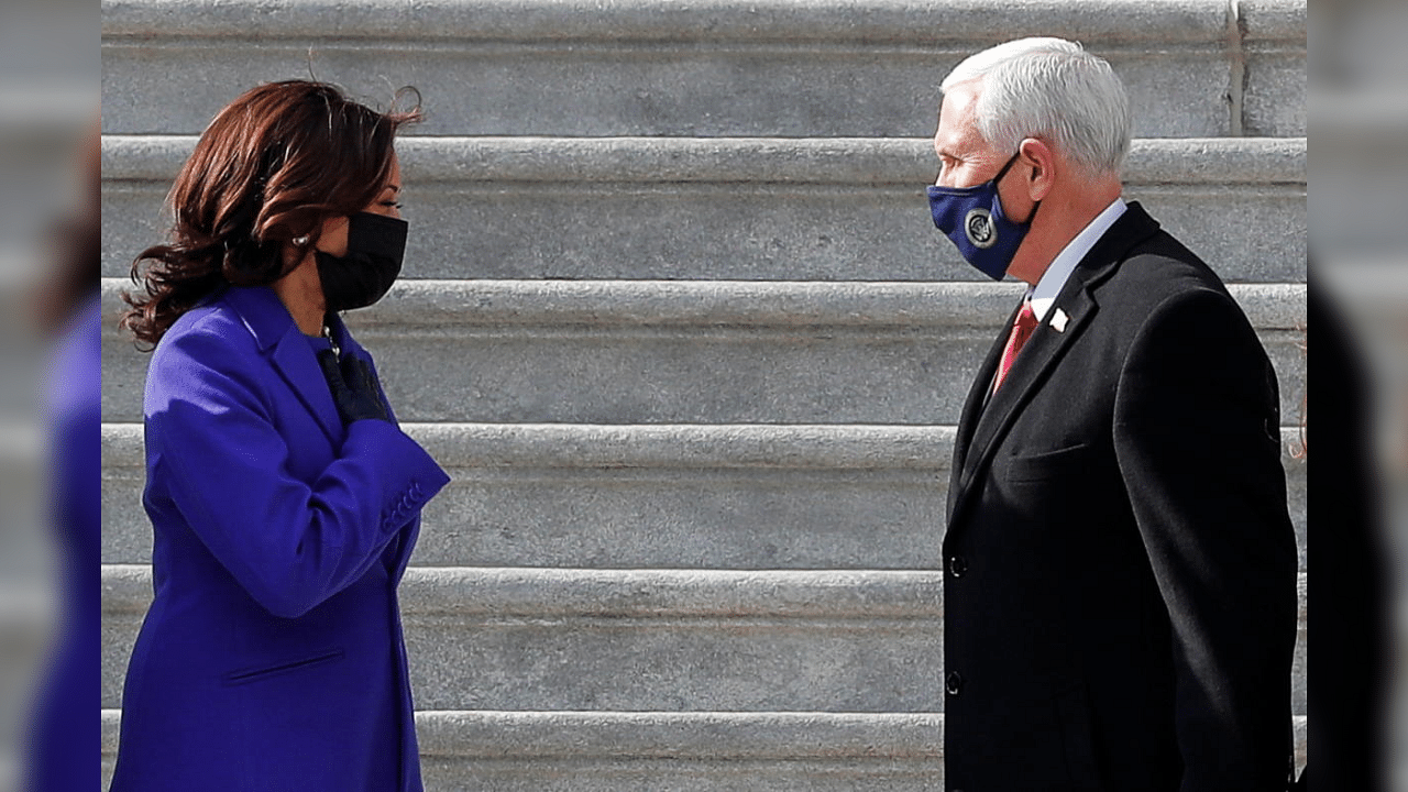 Former U.S. Vice President Mike Pence and U.S. Vice President Kamala Harris talk after the inauguration of Joe Biden as the 46th President of the United States, in Washington, U.S., January 20, 2021. Credit: Reuters Photo