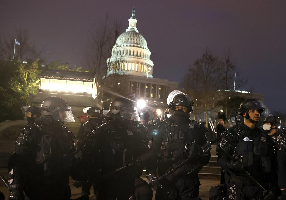  Police officers in riot gear line up as protesters gather on the U.S. Capitol Building on January 06, 2021 in Washington, DC. Credit: AFP file photo. 