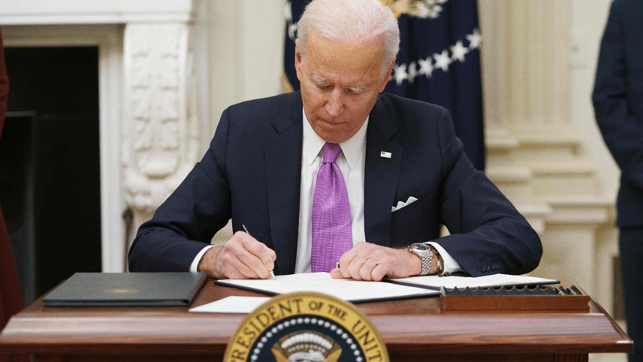US President Joe Biden signs executive orders. Credit: AFP Photo