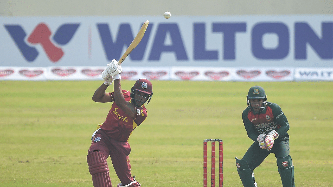 West Indies' Kjorn Ottley (L) plays a shot during the second one-day international (ODI) cricket match between Bangladesh and West Indies at the Sher-e-Bangla National Cricket Stadium in Dhaka. Credit: AFP Photo