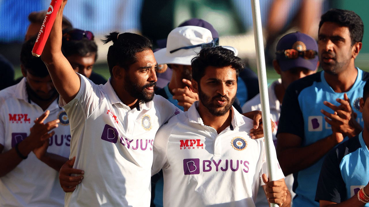 India's pacemen Mohammed Siraj (L) and Shardul Thakur celebrate the victory in the fourth cricket Test match against Australia at The Gabba in Brisbane. Credit: AFP File Photo