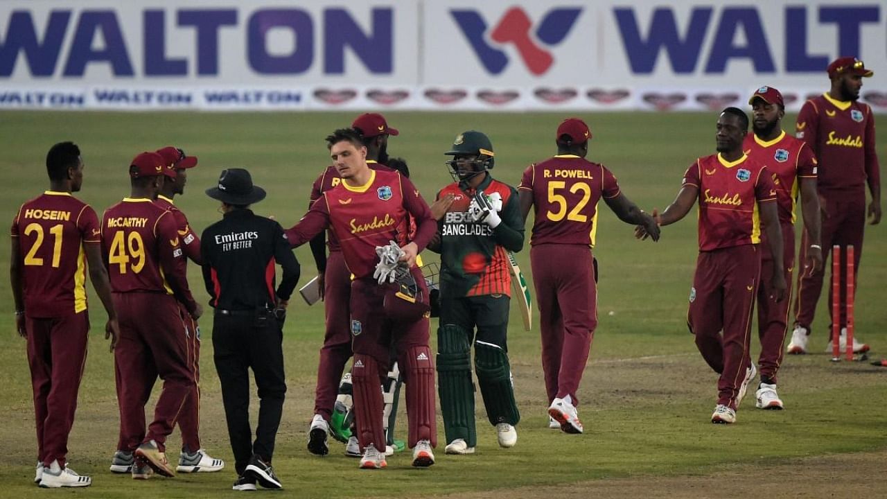 Bangladesh's and West Indies' players shake hands after the second one-day international (ODI) cricket match between Bangladesh and West Indies at the Sher-e-Bangla National Cricket Stadium in Dhaka on January 22. Credit: AFP Photo