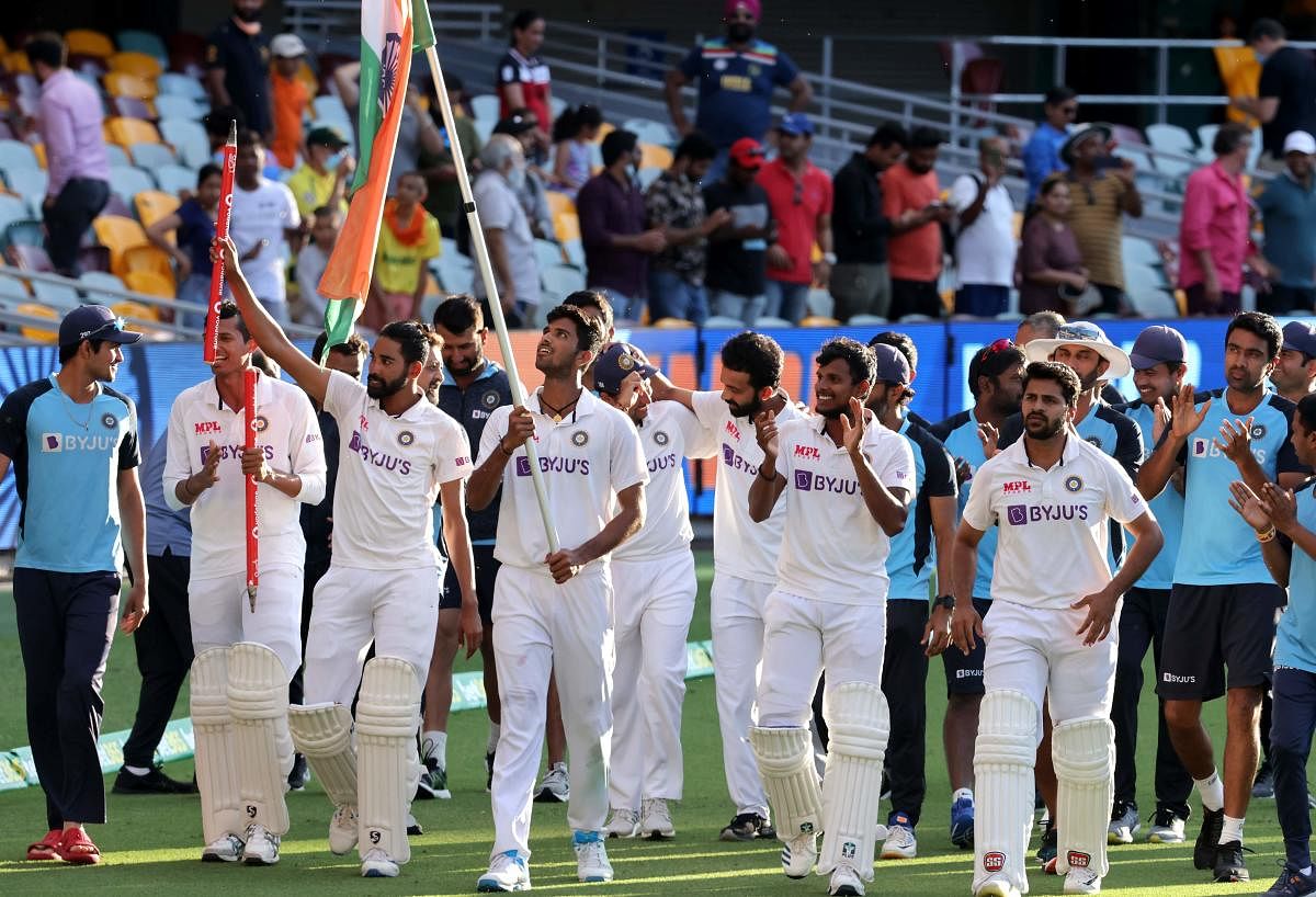 Indian players celebrate at the end of the fourth cricket Test match between Australia and India at The Gabba in Brisbane. Credit: AFP. 