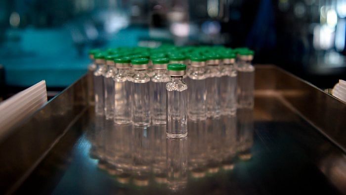 Vials of Covishield Covid-19 coronavirus vaccine are pictured inside a lab where they are being manufactured at Serum Institute in Pune. Credit: AFP Photo