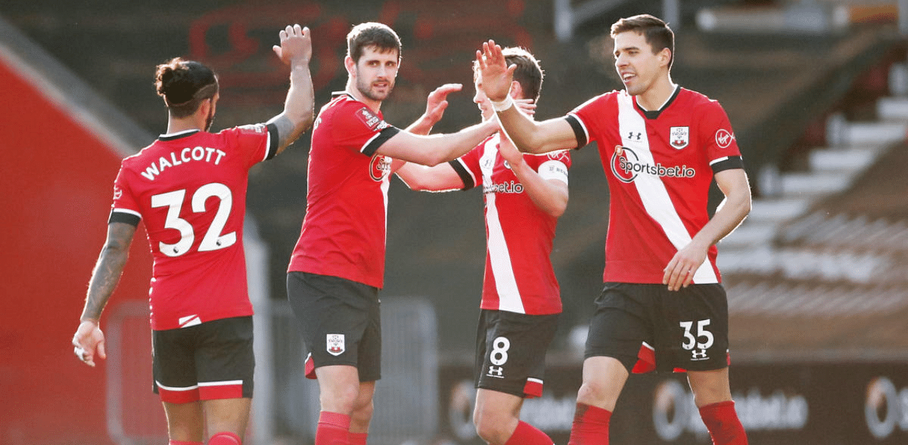 Southampton's Jan Bednarek, Jack Stephens and Theo Walcott celebrate after the match. Credit: Reuters Photo