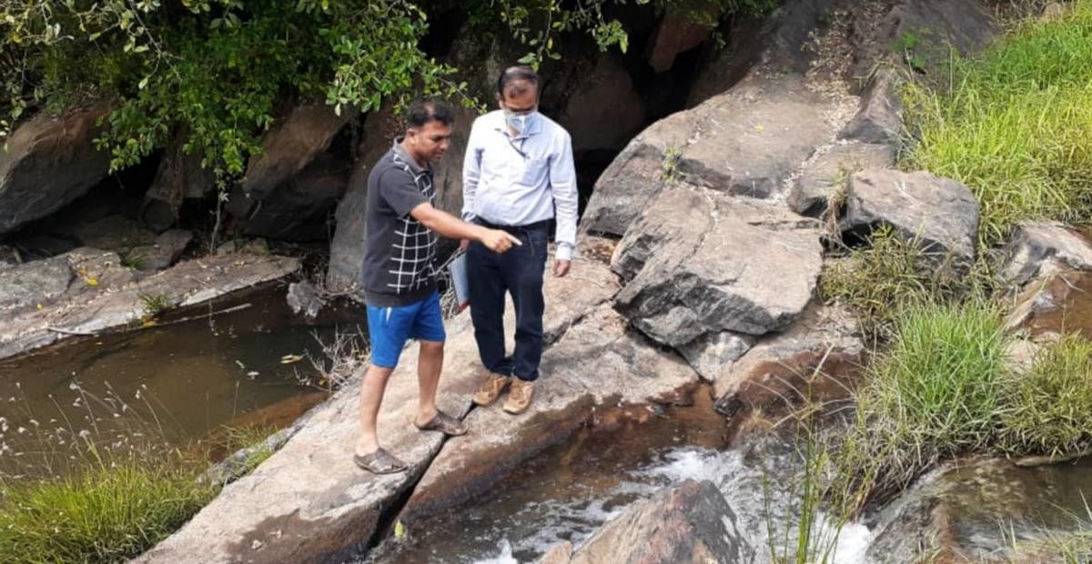 KSPCB officials inspect the place where effluents from coffee pulping units are released into Choranahole stream.