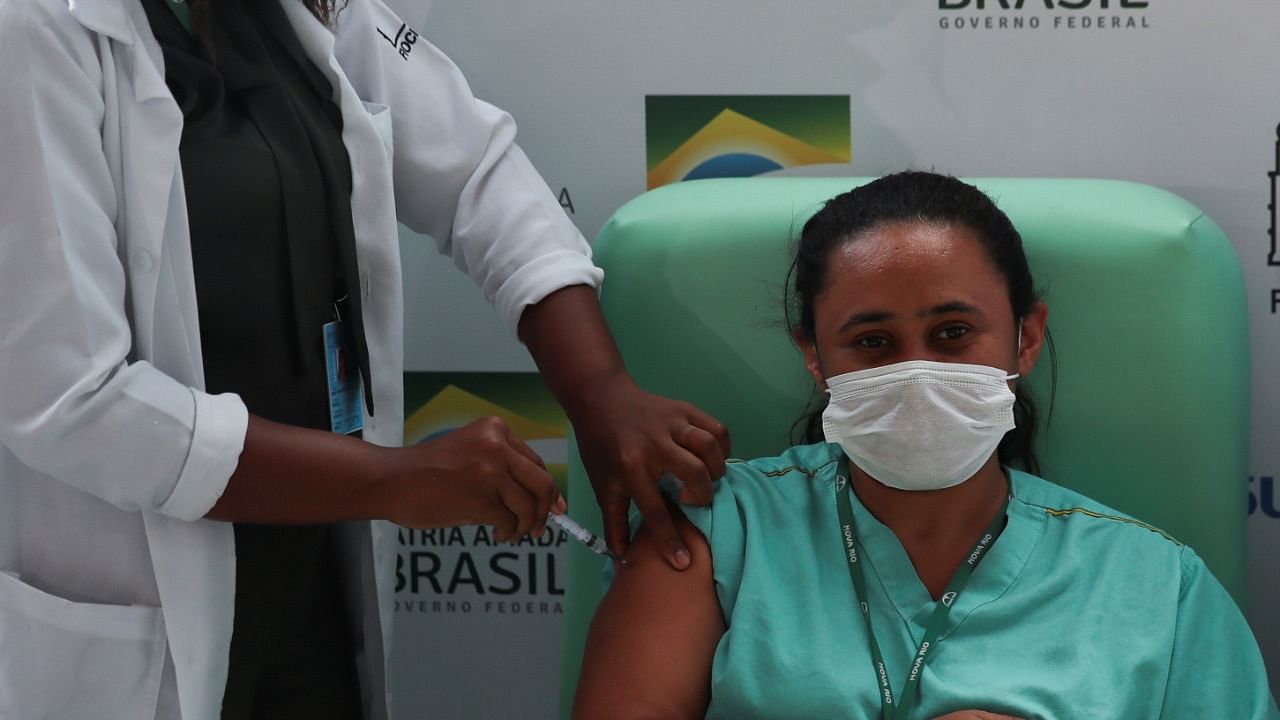 A healthcare worker receives the AstraZeneca/Oxford Covid-19 vaccine at FioCruz Institute in Rio de Janeiro, Brazil. Credit: Reuters Photo