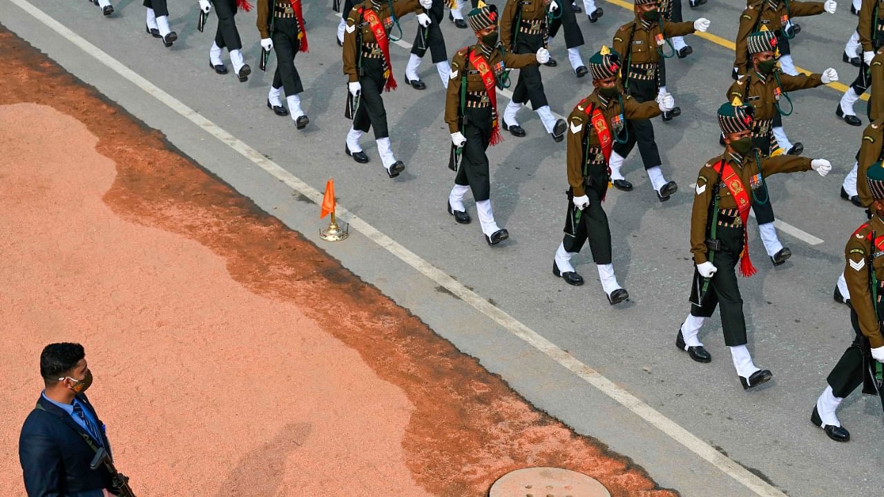 Soldiers march along the Rajpath during the full dress rehearsal for the upcoming Republic Day Parade in New Delhi on January 23, 2021. Credit: AFP Photo