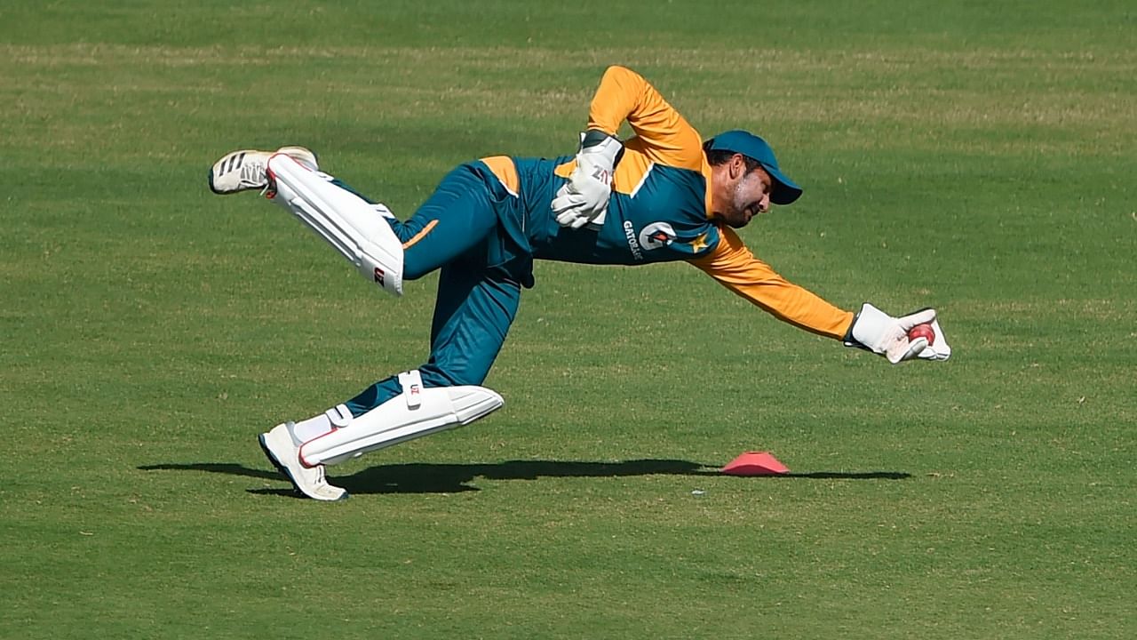 Pakistan's Sarfaraz Ahmed catches the ball during a practice session at the National Stadium in Karachi on January 24, 2021, ahead of their first cricket test match against South Africa to be played on January 26. Credit: AFP Photo