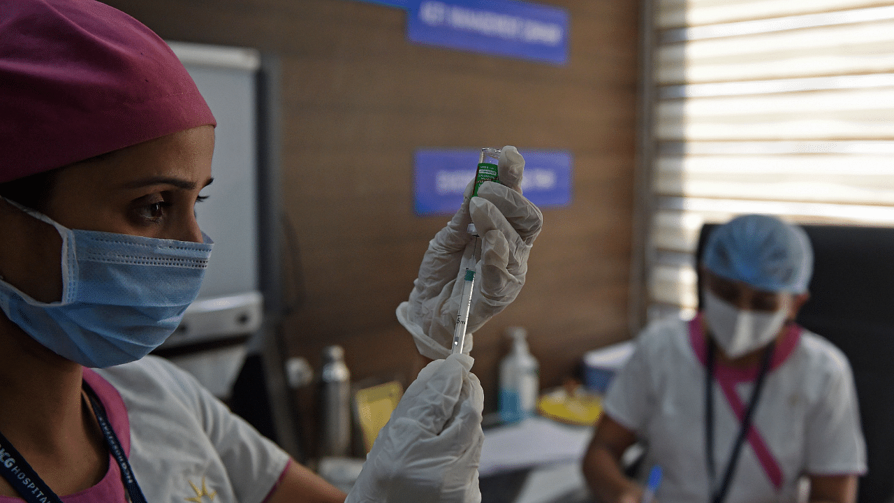 A medical worker fills a syringe with Covishield, AstraZeneca-Oxford's Covid-19 coronavirus vaccine made by India's Serum Institute, at a hospital in Ahmedabad. Credit: AFP Photo
