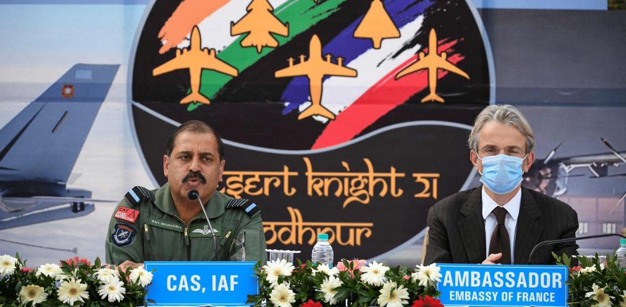 India's Chief of Air Staff Air Chief Marshal Rakesh Kumar Singh Bhadauria (L) addresses a press conference as France's Ambassador to India Emmanuel Lenain watches during Ex Desert Knight-21, a bilateral air exercise. Credit: AFP Photo