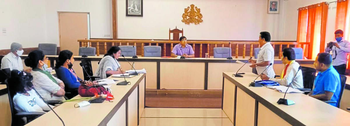 Zilla Panchayat CEO Bhanwar Singh Meena chairs a meeting in Madikeri.