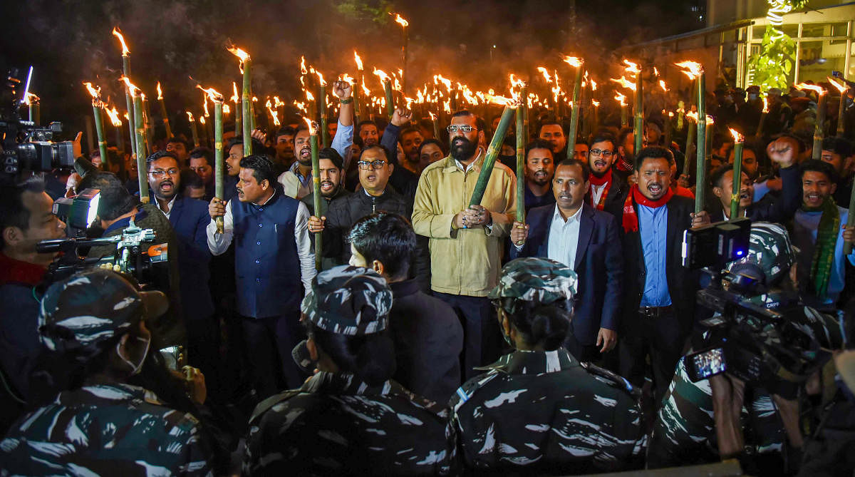 Activists of All Assam Students Union (AASU) take part in a torch rally to protest against Citizenship Amendment Act 2019, in Guwahati, Friday, Jan. 22 2021. Credit: PTI Photo
