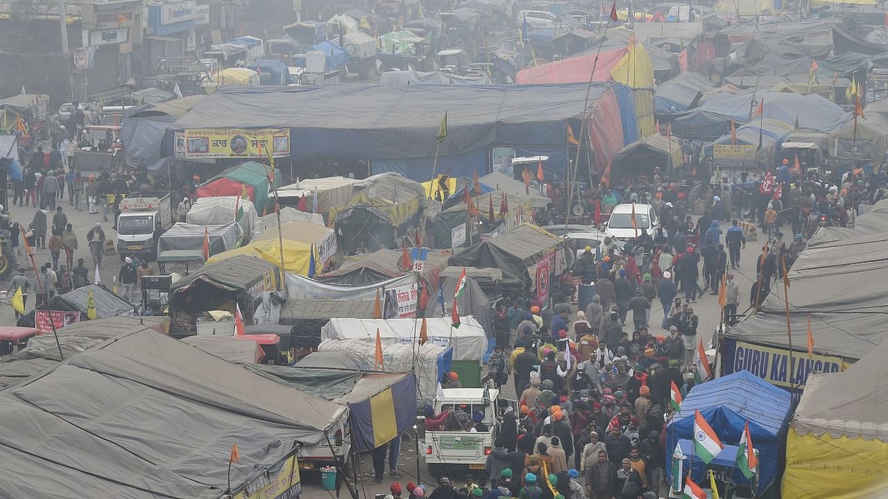 Tractors and trolleys parked at the site of farmers' ongoing agitation against the new farm laws, at the Singhu border, in New Delhi. Credit: PTI Photo