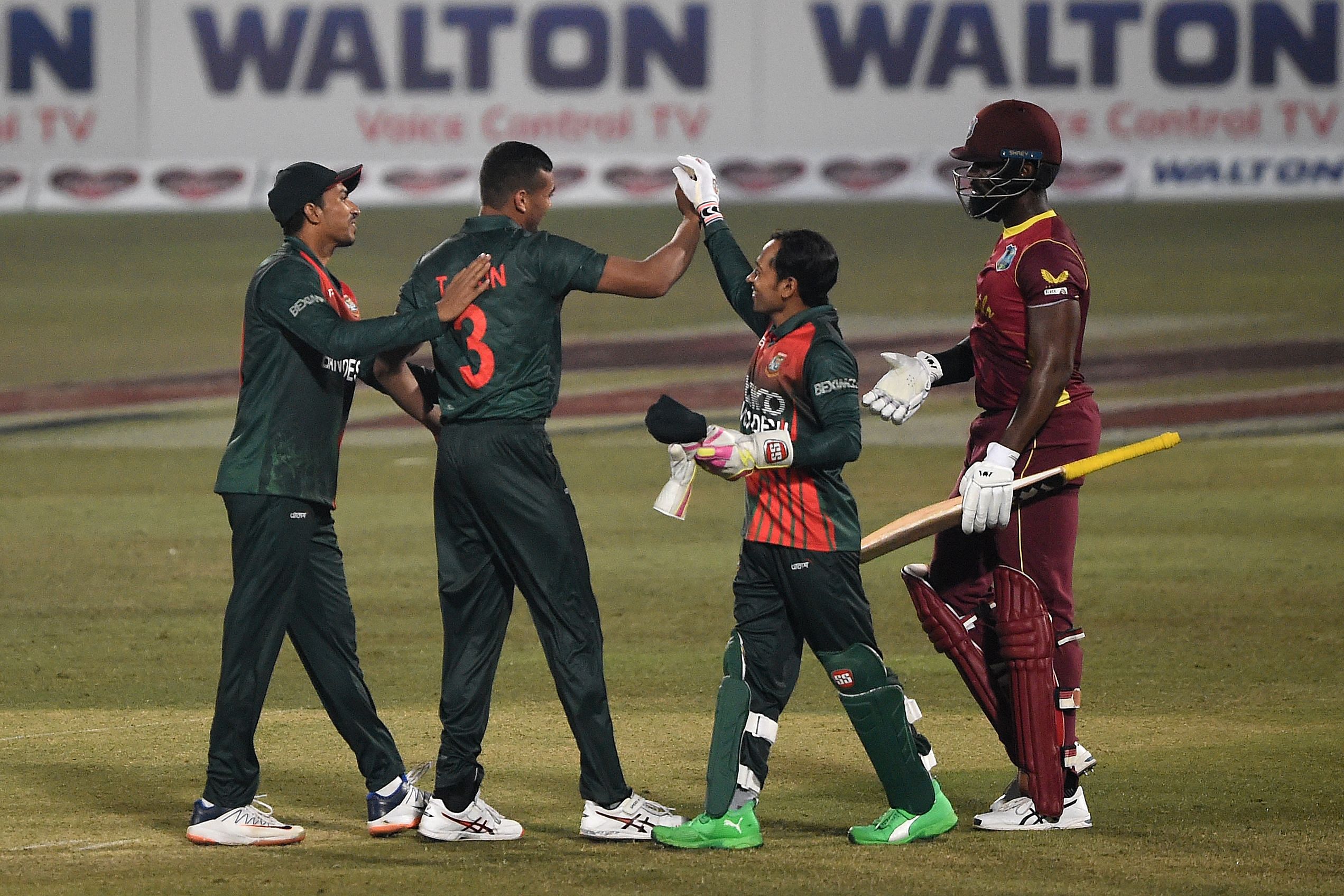 Bangladesh's players celebrate after the dismissal of West Indies' Raymon Reifer (R) during the third and final one-day international (ODI) cricket match between Bangladesh and West Indies. Credit: AFP Photo