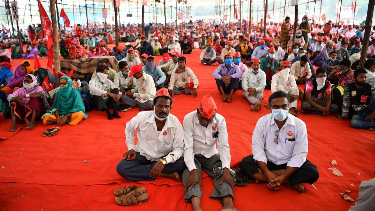 Farmers from rural Maharashtra listen to their leader during a sit-in protest at the Azad Maidan ground in support of farmers who are continuing their protest against the central government's recent agricultural reforms. Credit: AFP.