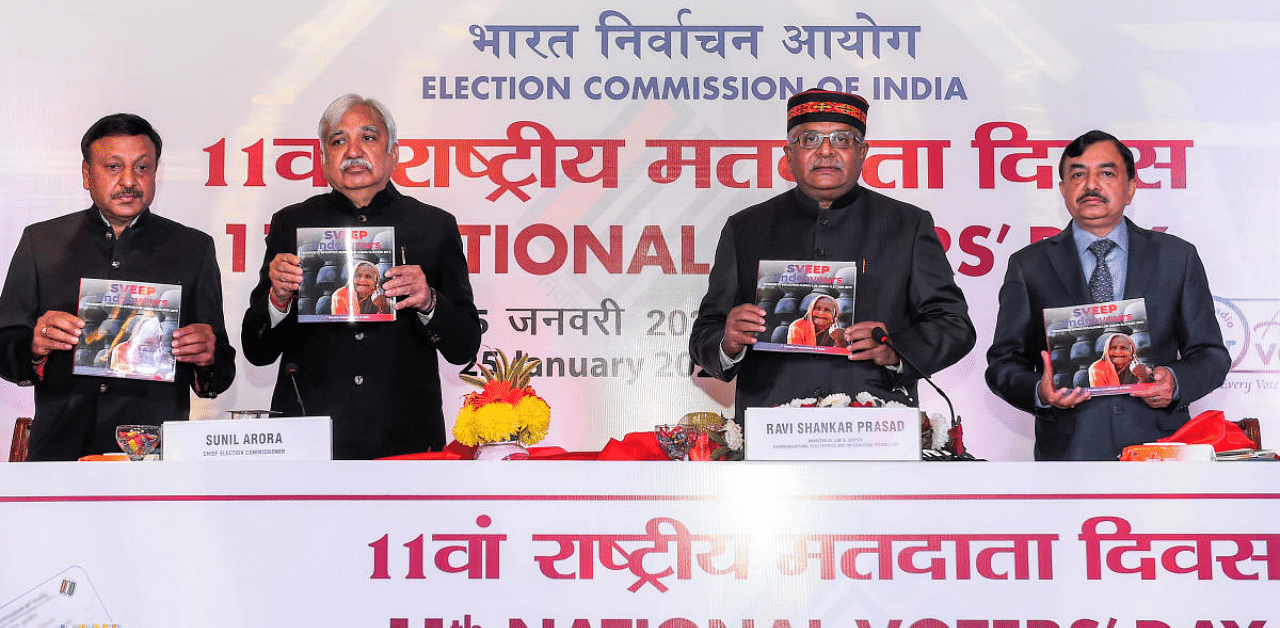 Union Law Minister Ravi Shankar Prasad (2R) with Chief Election Commissioner of India Sunil Arora (2L), and Election Commissioners Sushil Chandra (R) and Rajiv Kumar (L), releases a publication during the 11th National Voters’ Day celebrations. Credit: PTI Photo