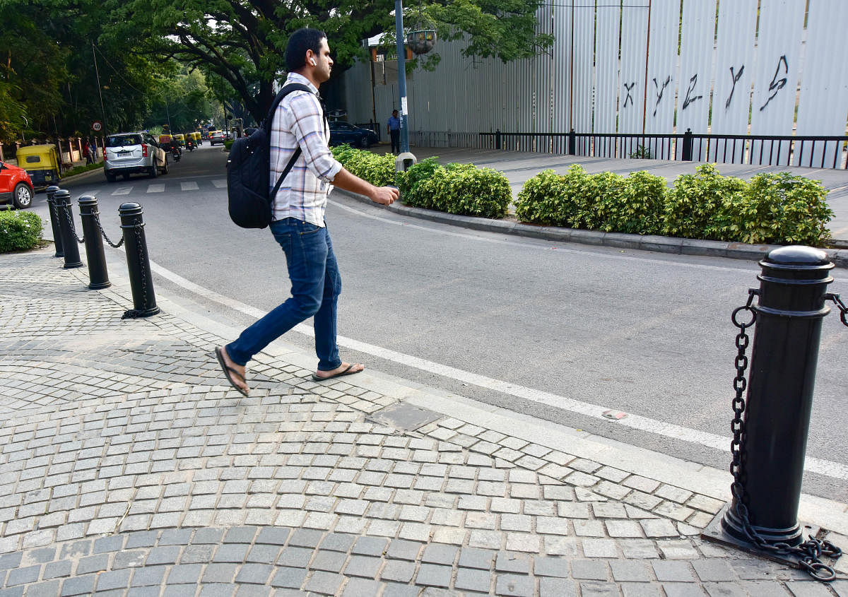 Researchers took a sample survey of 793 Bengaluru households and found that many people were ready to walk more for work-related trips such as to a pick-up or drop-by point. Credit: DH FILE PHOTO/Irshad Mahammad