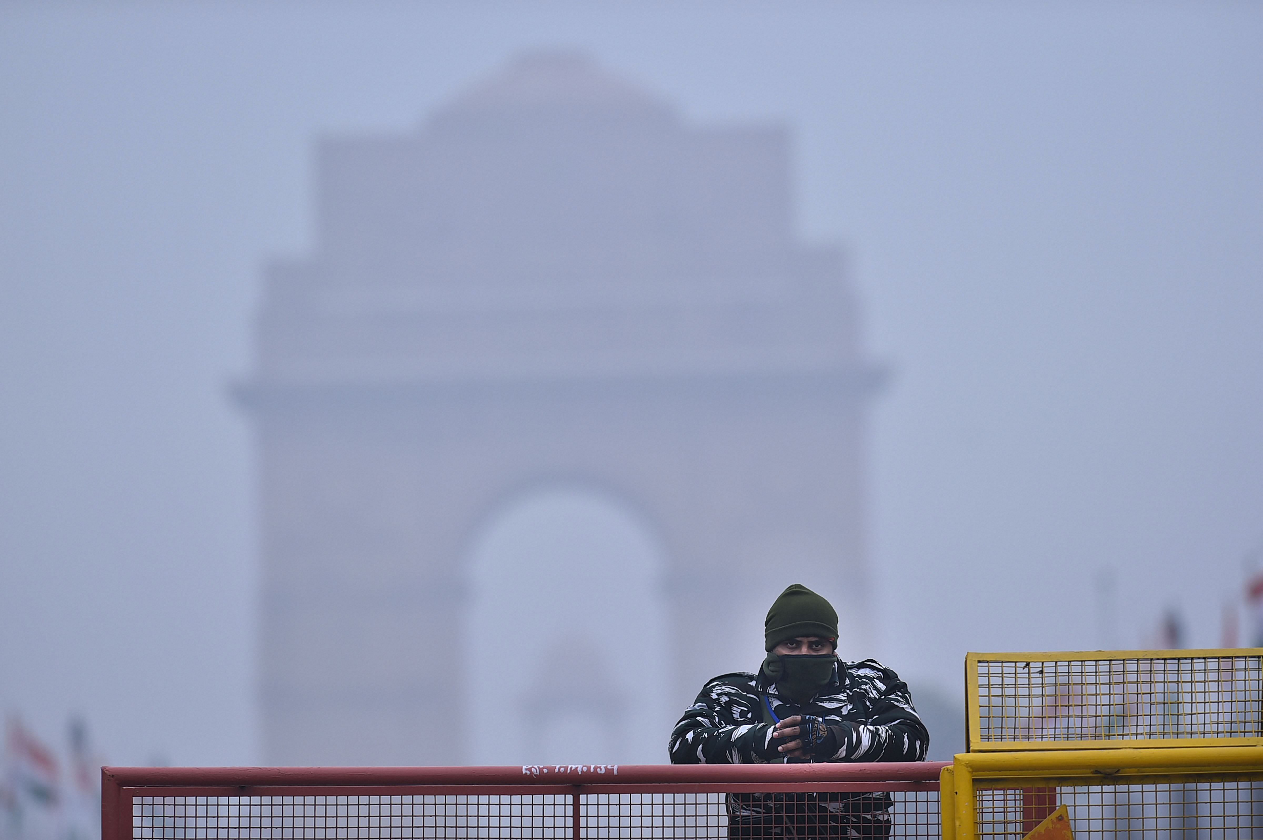  An Indian armed 'Rapid Response' team member stands guard at India Gate ahead of the Republic Day parade, in New Delhi, Sunday, Jan. 24, 2021. Credit: PTI Photo