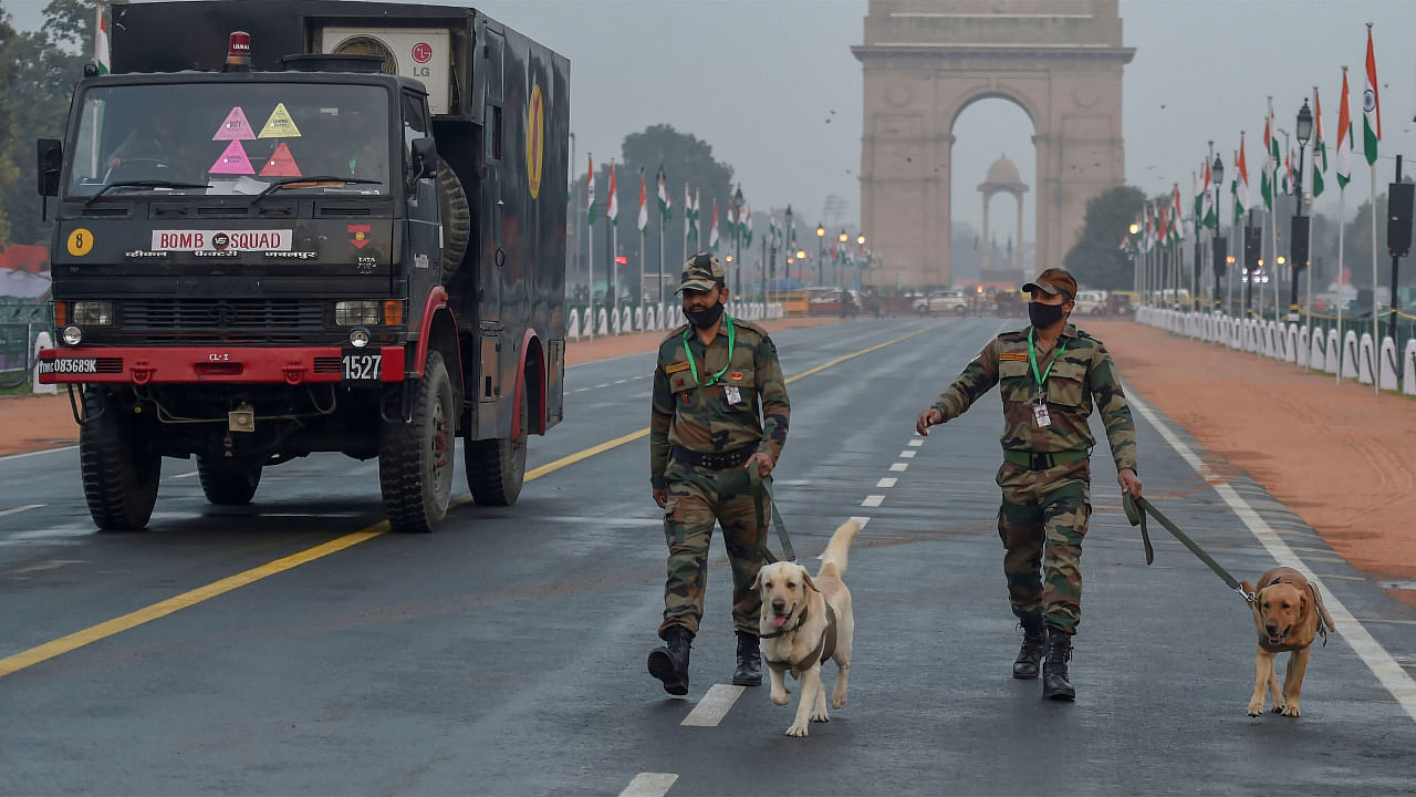 Security personnel keep vigil at Rajpath on the eve of the Republic Day parade, in New Delhi. Credit: PTI Photo
