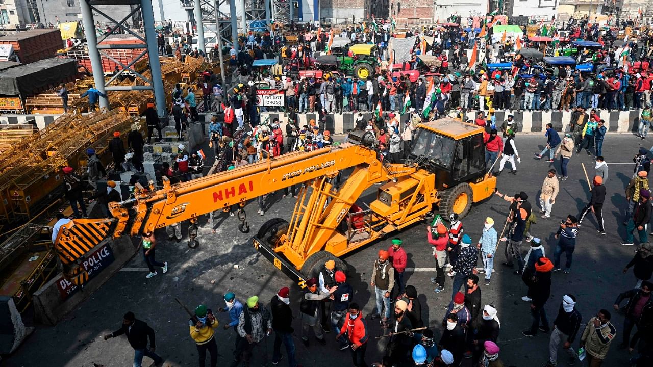 Farmers take part in a rally as they continue to protest against the central government's recent agricultural reforms, in New Delhi on January 26, 2021. Credit: AFP Photo