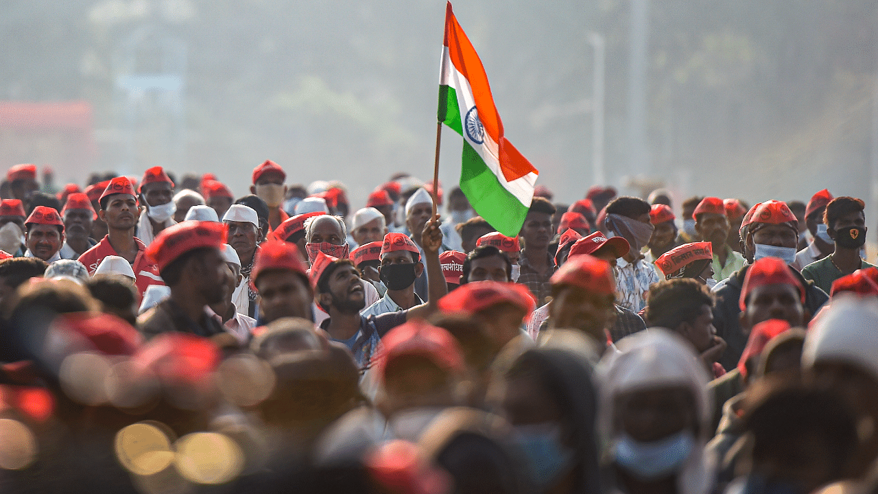 A farmer holding the Tricolour raises slogans during the 72nd Republic Day celebrations at Azad Maidan, in Mumbai. Credit: PTI Photo
