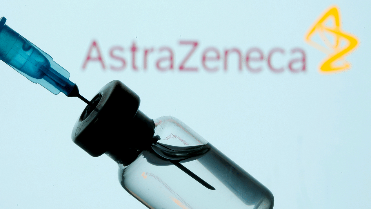Vial and sryinge are seen in front of displayed AstraZeneca logo. Credit: Reuters Photo