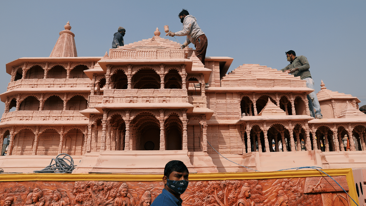 Workers give finishing touches to the model of the proposed Ram temple that Hindu groups want to build at a religious site in Ayodhya. Credit: Reuters Photo