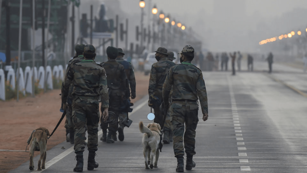 Security personnel keep vigil at Rajpath on the eve of the Republic Day parade, in New Delhi, Monday, Jan 25, 2021. Credit: PTI Photo