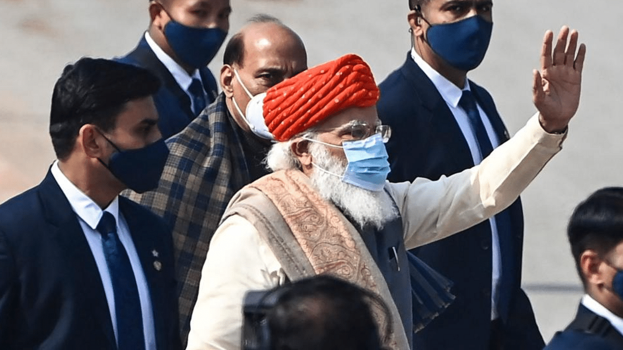 India's Prime Minister Narendra Modi (C) waves as he leaves after attending the Republic Day parade in New Delhi on January 26, 2021. Credit: AFP Photo