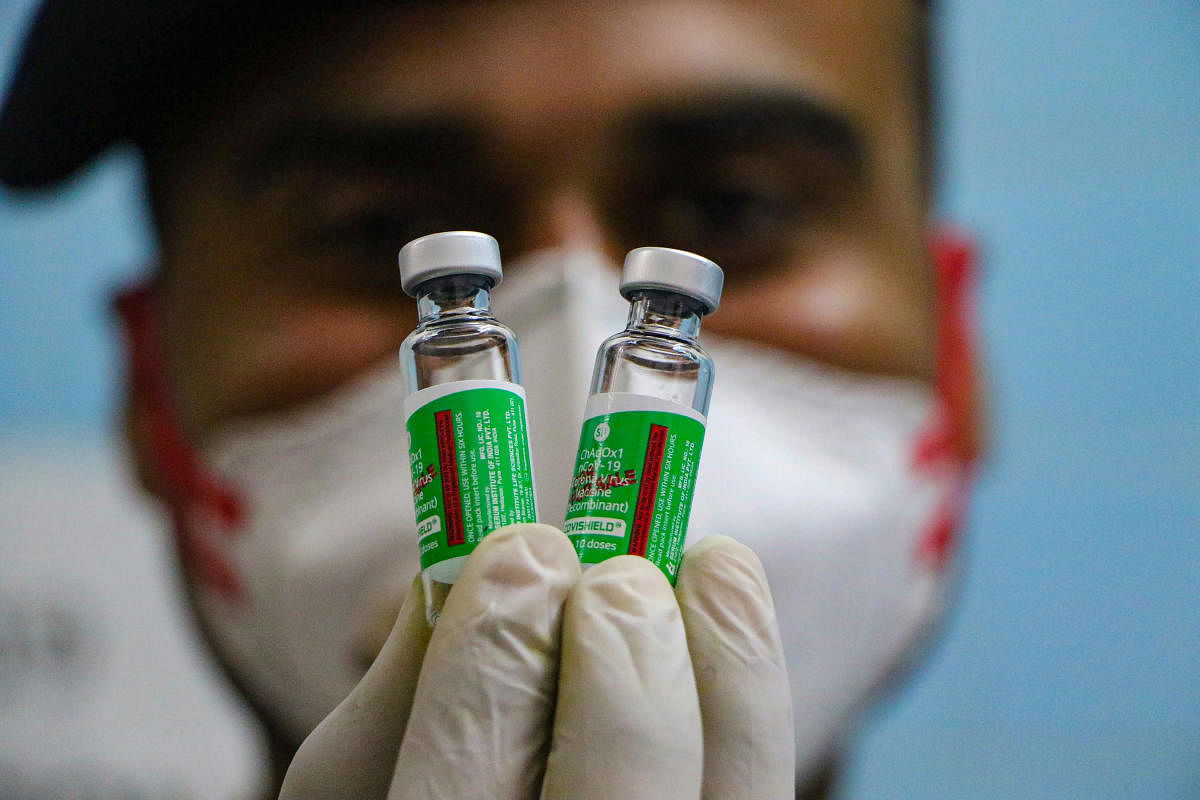 A medic show a vial containing doses of Covishield vaccine during a countrywide inoculation drive against the coronavirus, at BSF Hospital in Jammu, Monday, Jan. 25, 2021. Credit: PTI Photo