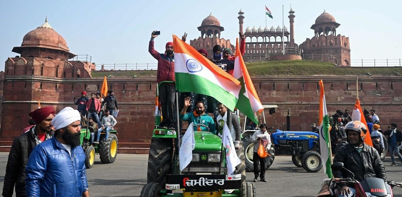 Farmers take part in a tractor rally as they continue to protest against the central government's recent agricultural reforms, in front of Red Fort in New Delhi on January 26, 2021. Credit: AFP Photo