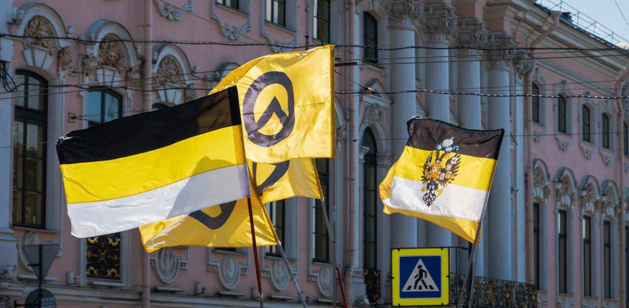 Identitarian Movement flags at political parade in Russia. Lambda, the symbol of Identitarianism is used primarily in Europe by Generation Identity. Credit: iStock Images