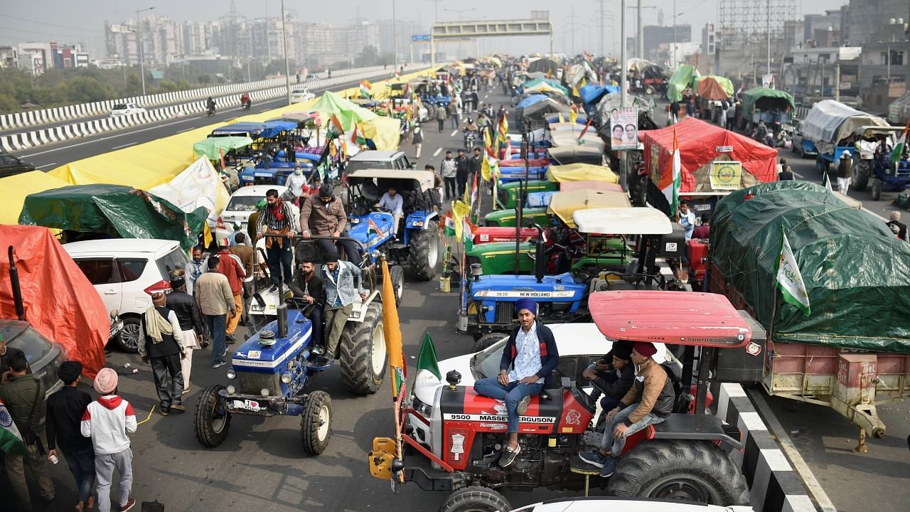 Farmers on their tractors during the ongoing protest against the new farm laws, at Ghazipur border in New Delhi. Credit: PTI Photo