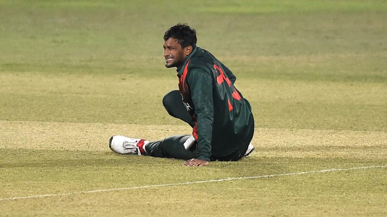 Bangladesh's Shakib Al Hasan reacts after being injured during the third and final one-day international (ODI) cricket match between Bangladesh and West Indies at the Zohur Ahmed Chowdhury Stadium in Chittagong. Credit: AFP.