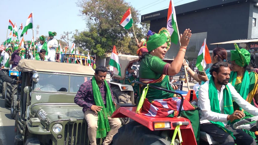 Farmers and farmer union leaders sit on mud guards of tractors during the tractor rally in Kalaburagi on Tuesday. Credit: Special arrangement