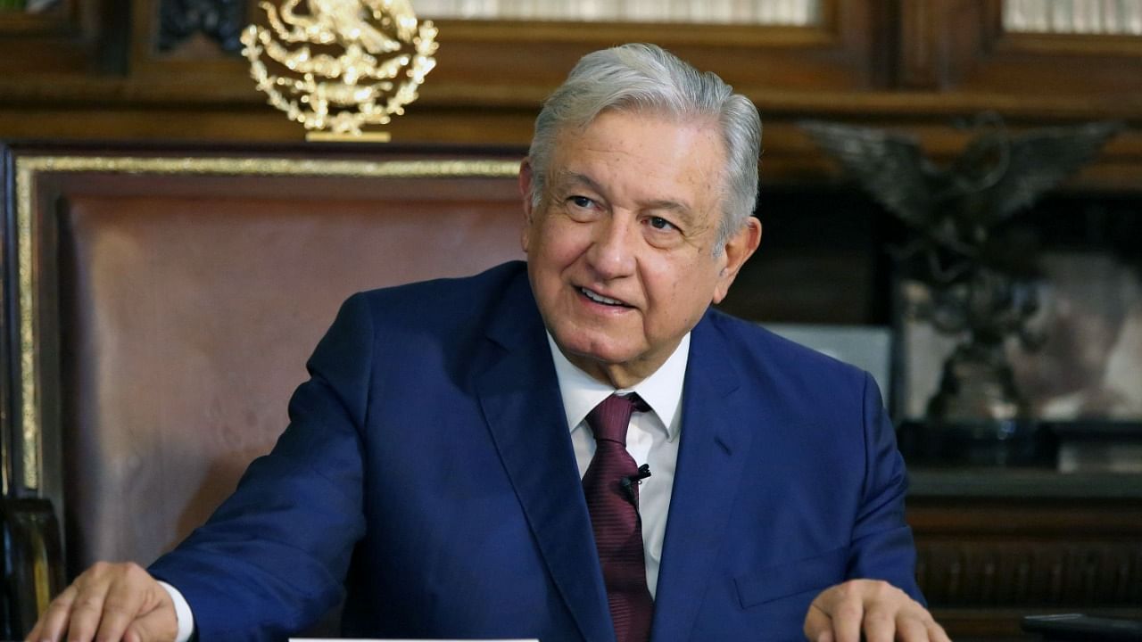 Mexico's President Andres Manuel Lopez Obrador during a phone call with the President of Russia, Vladimir Putin, in Mexico City. Credit: AFP File Photo