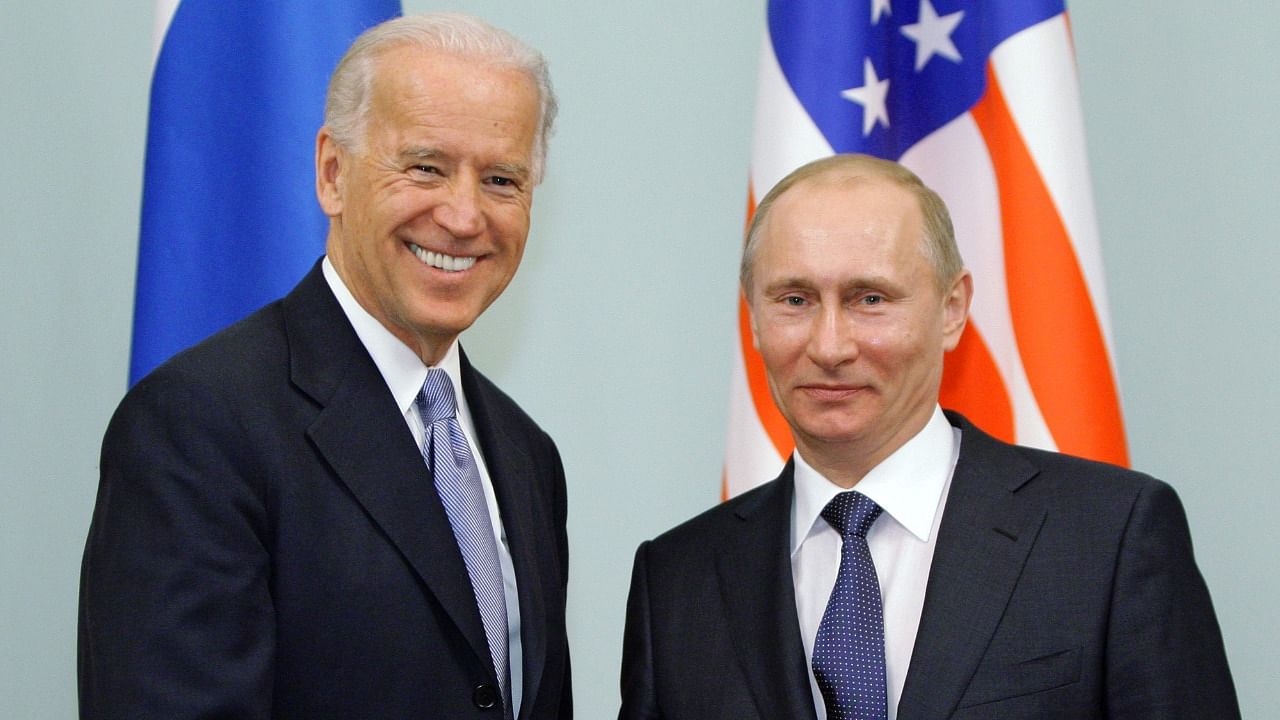 Russian President Vladimir Putin (R) shakes hands with US President Joe Biden during their meeting in Moscow. Credit: AFP File Photo