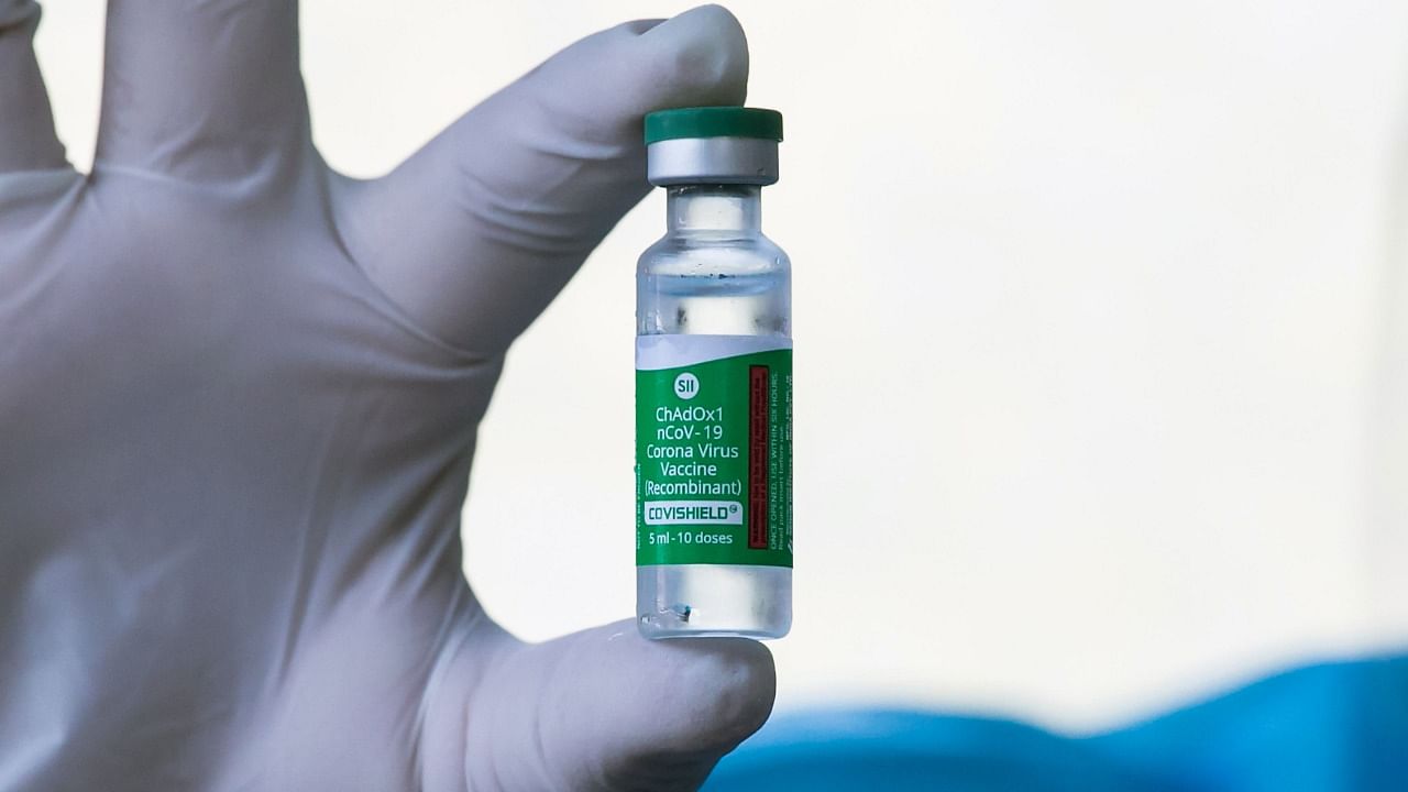 A health worker holds up a vial of Covishield, AstraZeneca-Oxford's Covid-19 coronavirus vaccine. Credit: AFP Photo