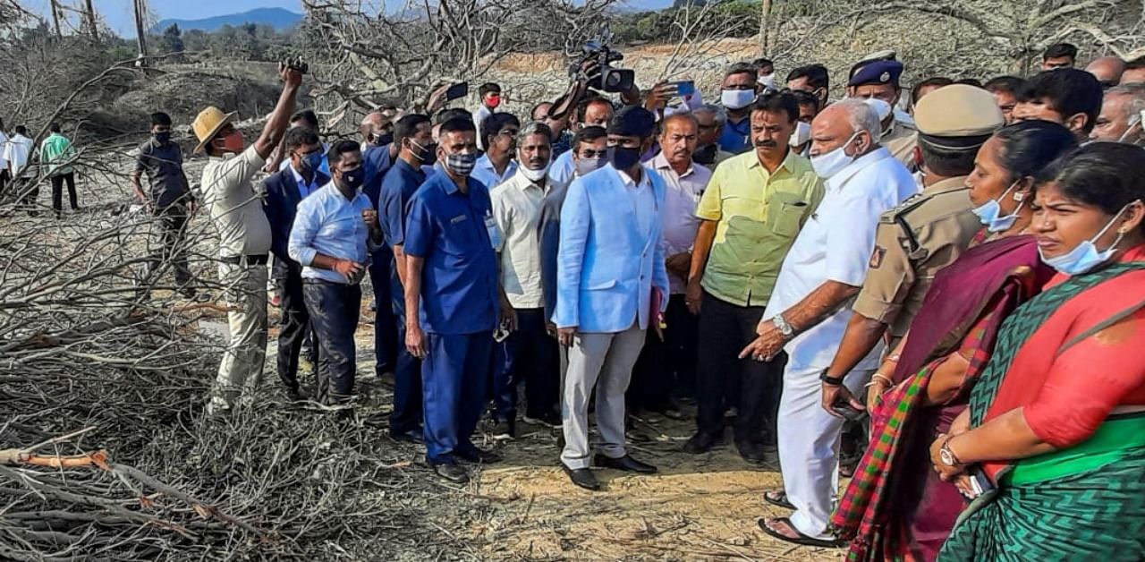 Karnataka Chief Minister B S Yediyurappa visits the spot, where at least six persons were killed in a dynamite blast on Friday, in Shivamogga district. Credit: PTI Photo