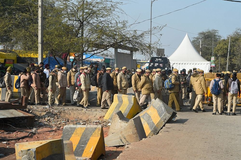 Police personnel near the site of farmers' ongoing agitation over the new farm laws, at Singhu border in New Delhi. Credit: PTI Photo