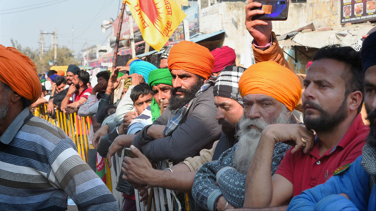Farmers during their ongoing agitation over the new farm laws, at Singhu border in New Delhi. Credit: PTI Photo