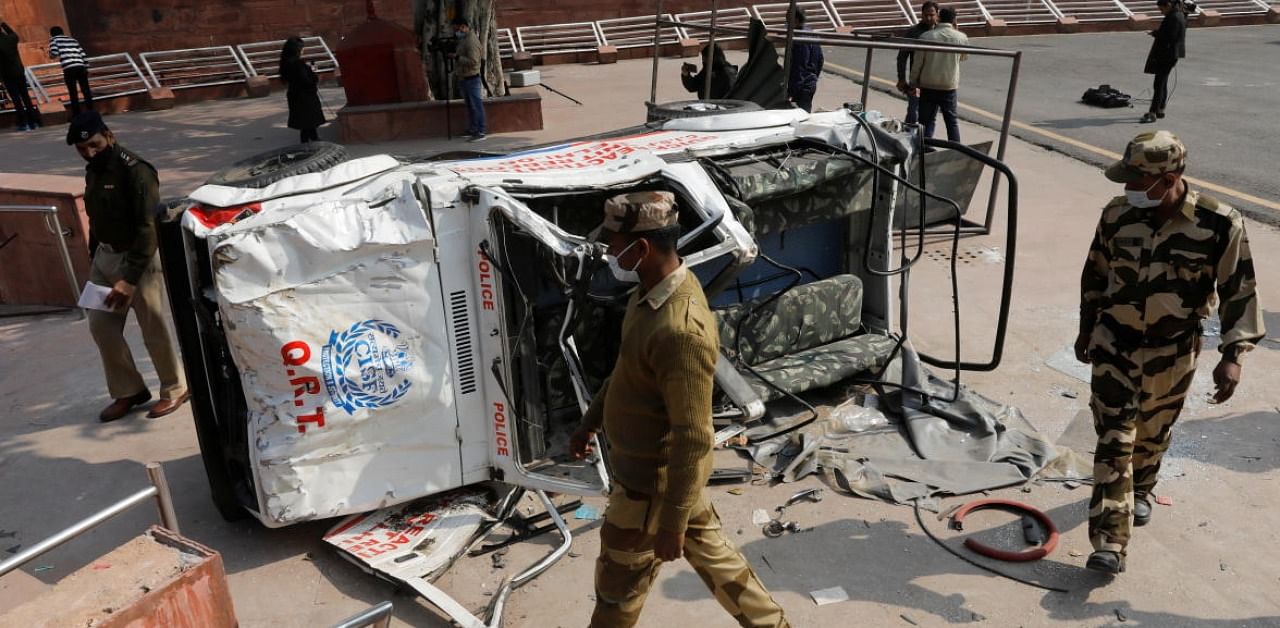 A damaged police vehicle is seen in the courtyard of Red Fort in New Delhi on January 27, 2021, as police closed several main roads a day after farmers went on the rampage in the capital, leaving one person dead and dozens injured. Credit: AFP Photo