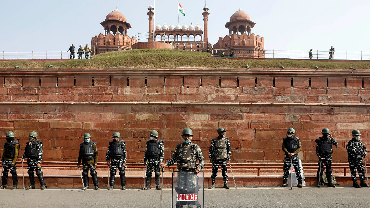 Policemen stand guard in front of the historic Red Fort after Tuesday's clashes between police and farmers, in the old quarters of Delhi. Credit: Reuters Photo