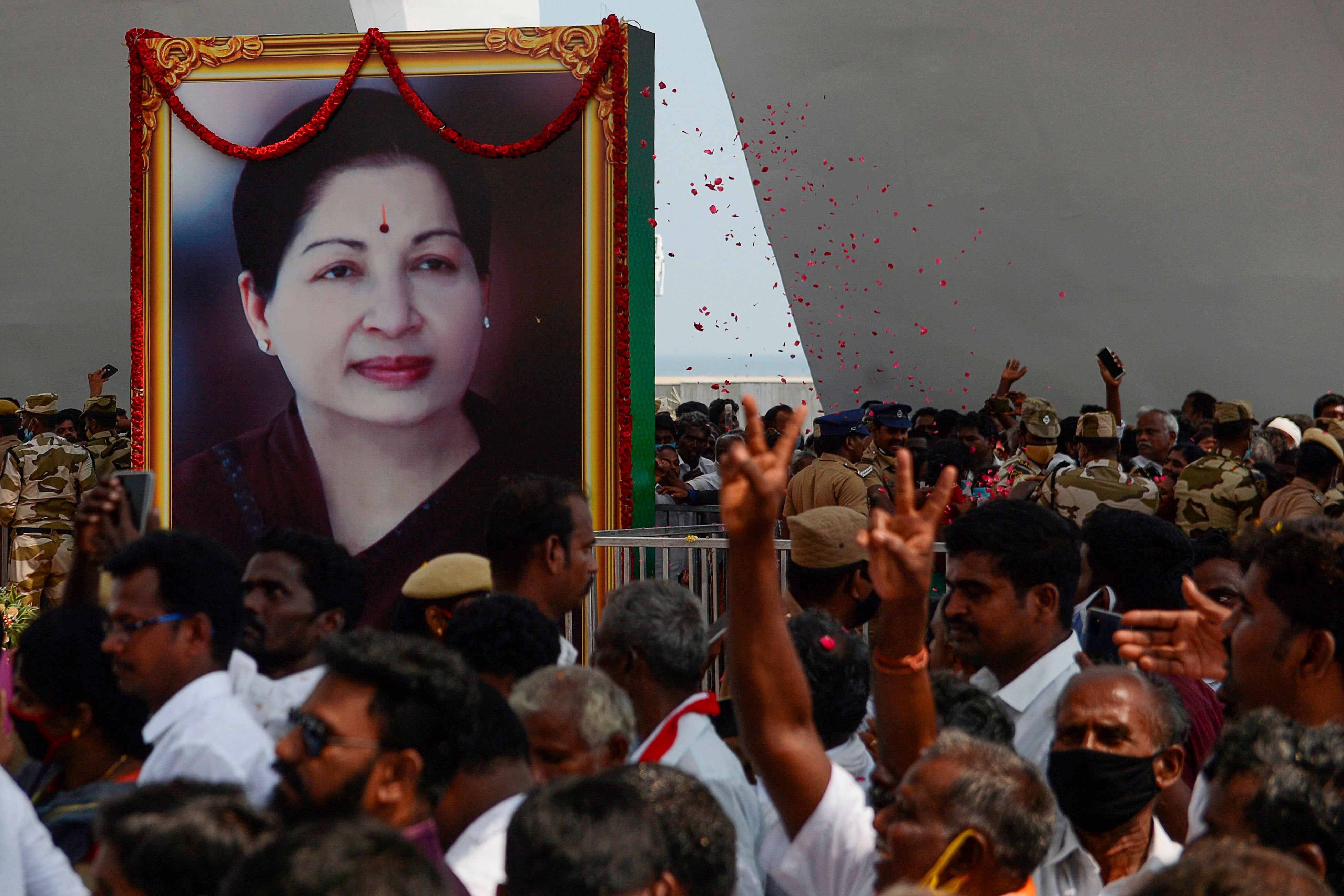 Carders of All India Anna Dravida Munnetra Kazhagam (AIADMK) party gather during the inauguration ceremony of the memorial for late Tamil Nadu Chief Minister J. Jayalalithaa, in Chennai on January 27, 2021. Credit: AFP Photo