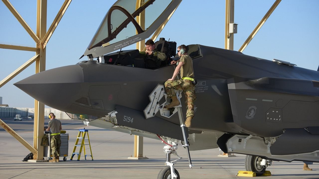 US soldiers standing next to an F-35A Lightning II stationed at the Emirati Al-Dhafra base, about 32 kilometres south of Abu Dhabi. Credit: AFP File Photo